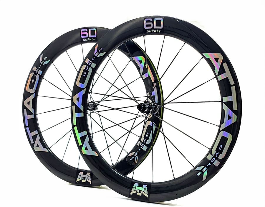 ATTACKCYCLES SuPrLt 6D/6D wheelset with silver rainbow decals, photographed at an angle.